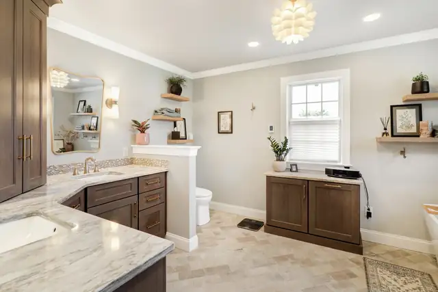 Lititz, PA bathroom by ALL Renovation & Design with a walk-in glass shower and custom cabinetry