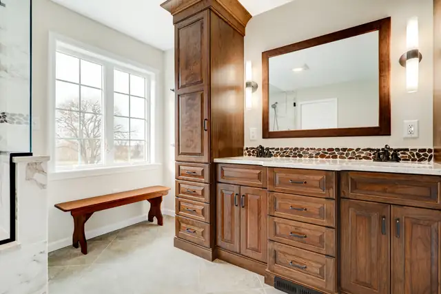 Spa-style bathroom remodel in Lebanon, PA with custom cabinets and a walk-in shower
