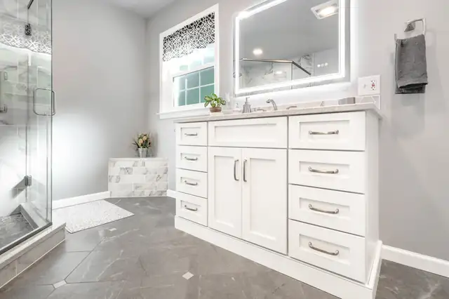 Bathroom remodel in Red Lion, PA with a tub and custom tile shower